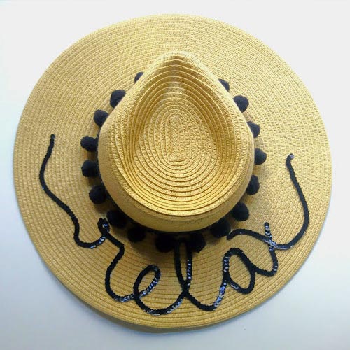 Sombrero de paja con lentejuelas y madroños